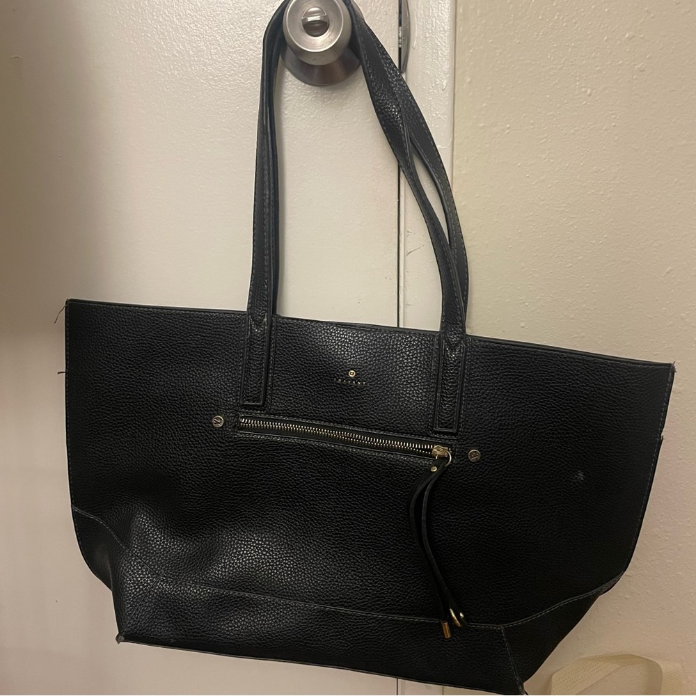 Black leather tote bag with pebbled texture, signs of wear